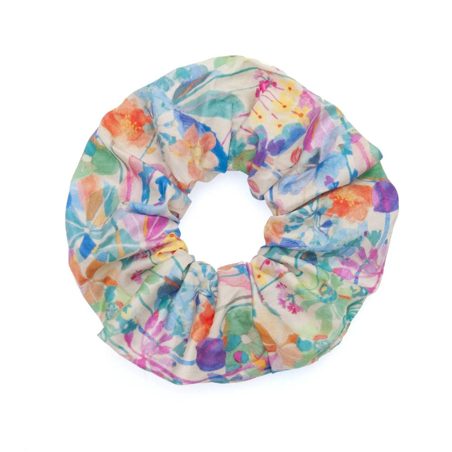 Watercolor fabric scrunchie featuring a vibrant and artistic design, perfect for adding a pop of color to any hairstyle.