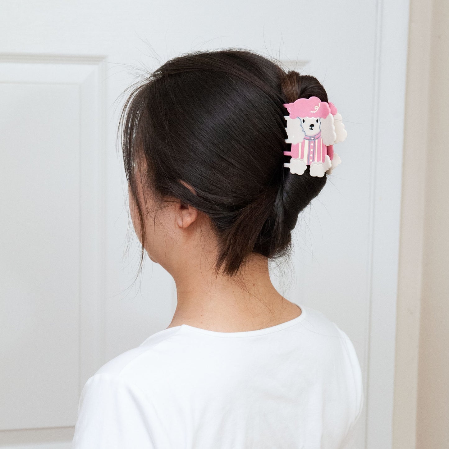 a woman wearing Poodle Dog Hair Claw for a full up hairstyle