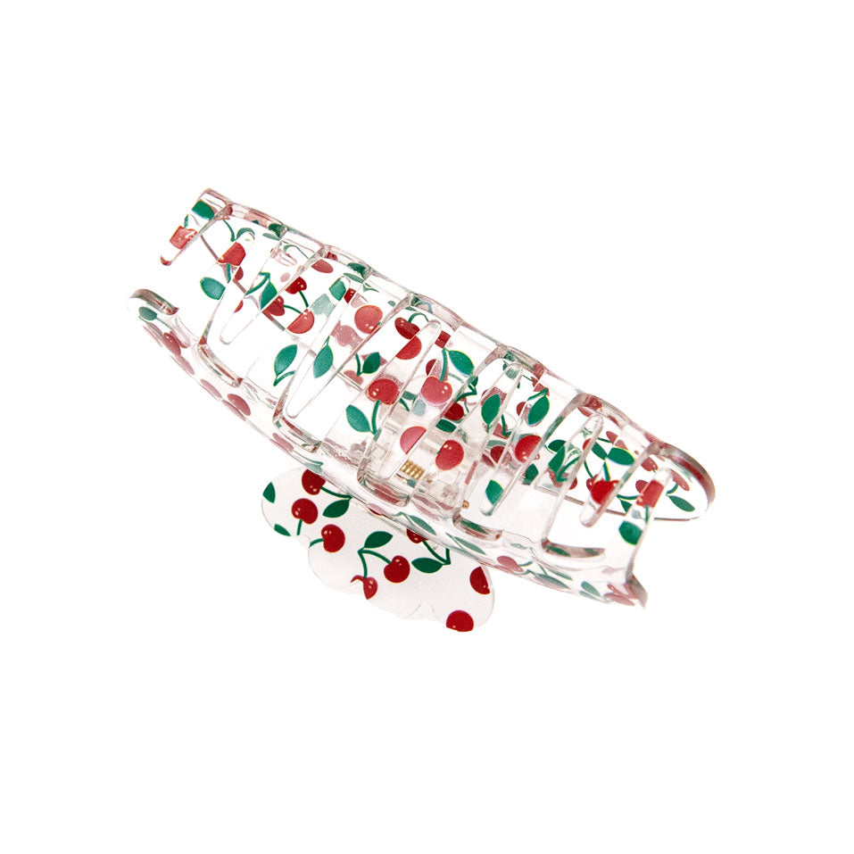 teeth detail of a large cherry print hair clip