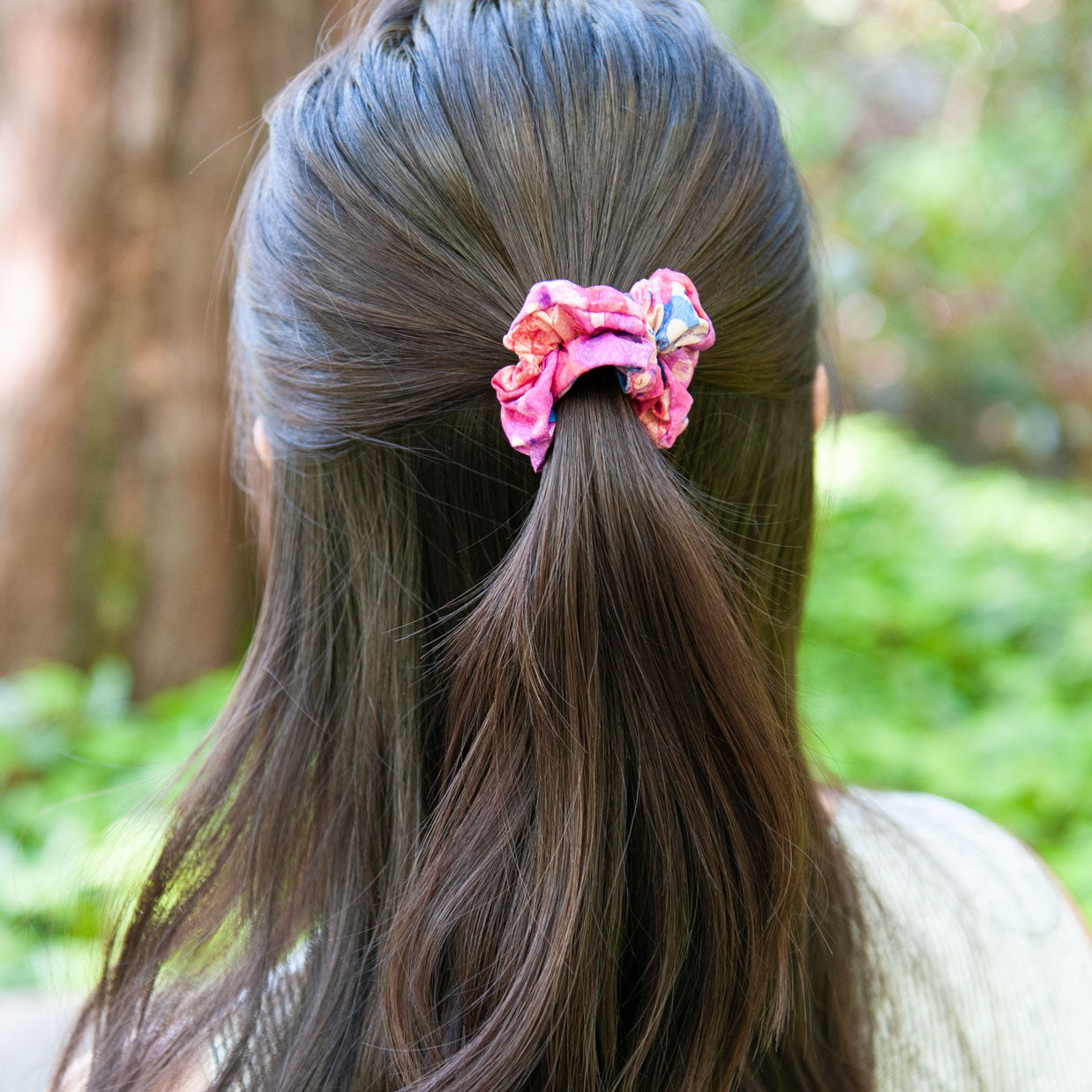 a woman wearing a pink liberty fabric scrunchie for half up hairstyle