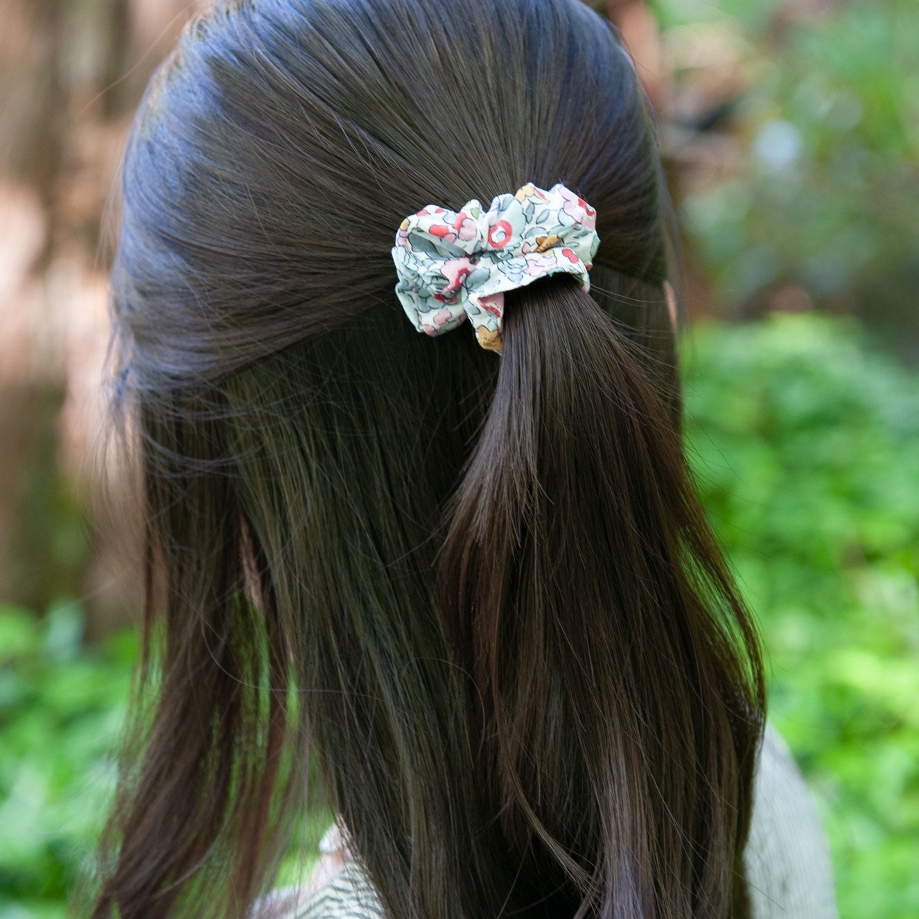 a woman wearing a liberty fabric scrunchie in Betsy in skinny size