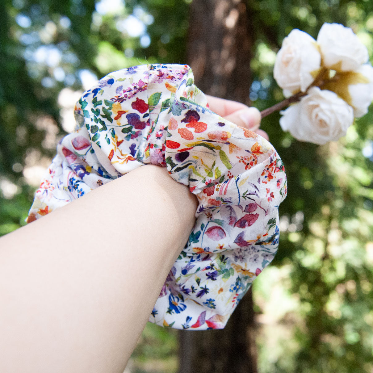 wearing liberty fabric scrunchie on wrist