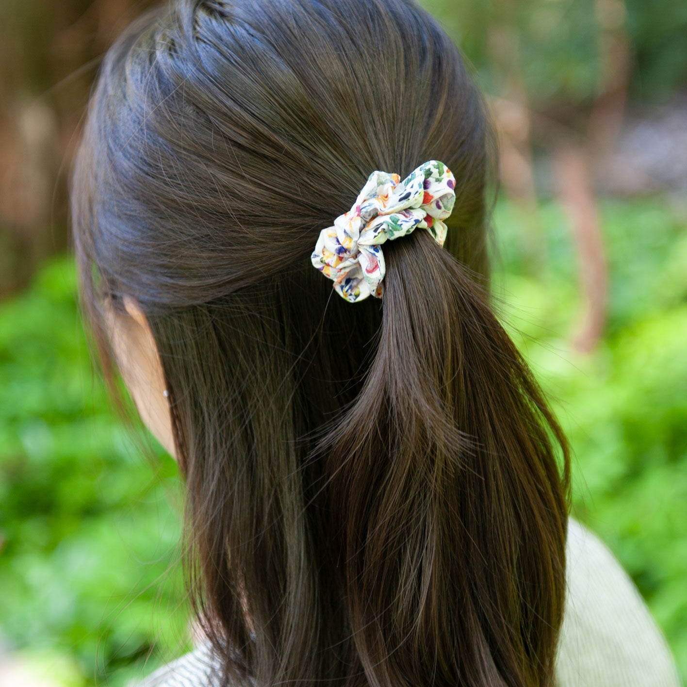 a woman wearing a liberty fabric scrunchie in skinny size