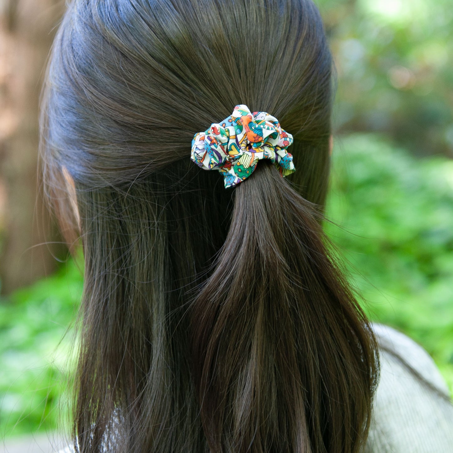 a woman wearing a skinny size liberty fabric scrunchie