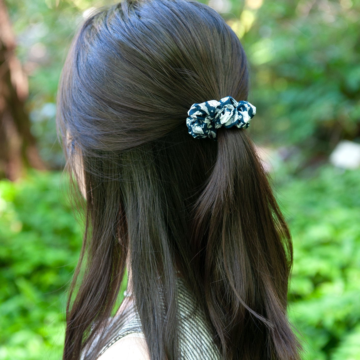 a woman wearing a skinny size liberty fabric scrunchie
