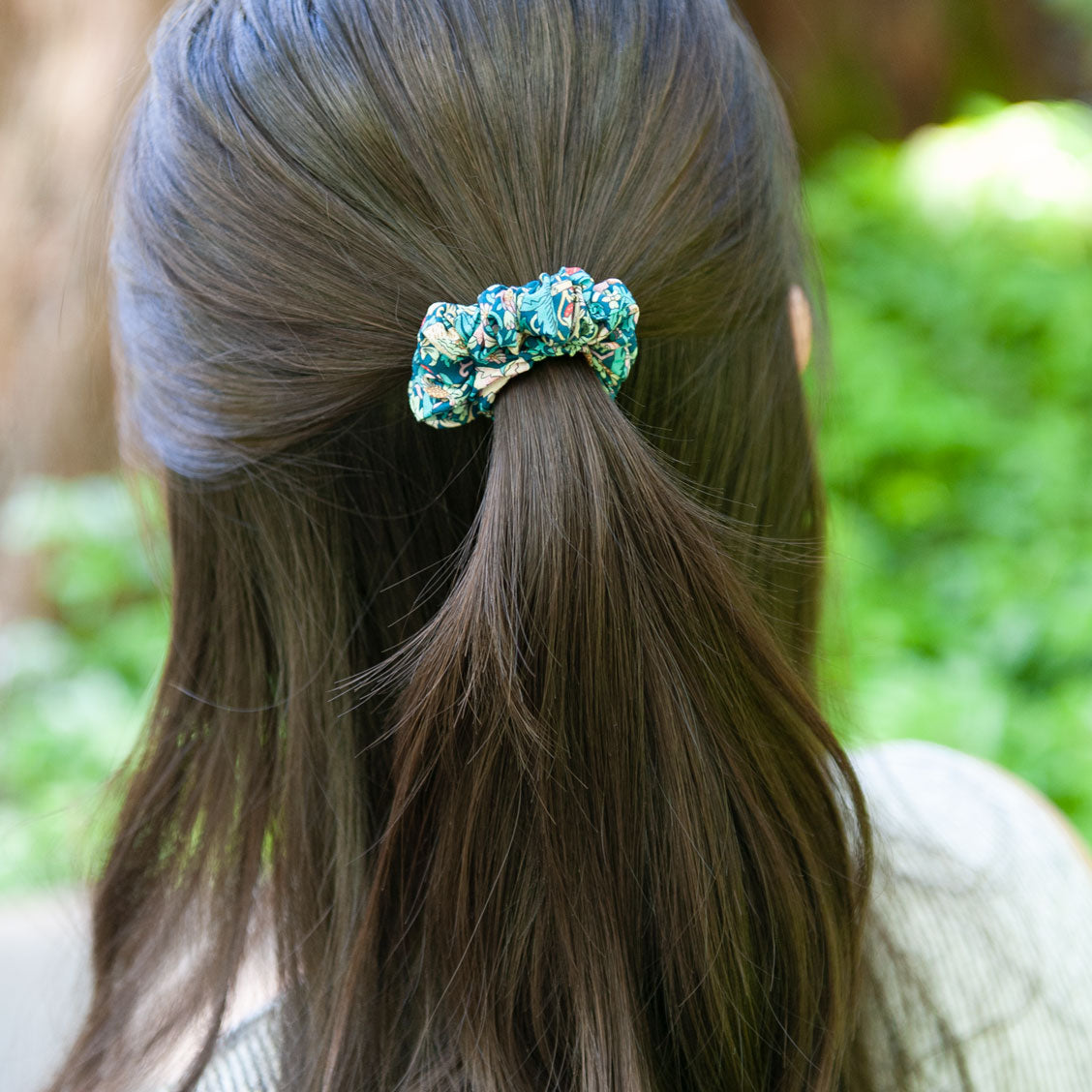 a woman wearing a liberty fabric scrunchie for half up hairstyle