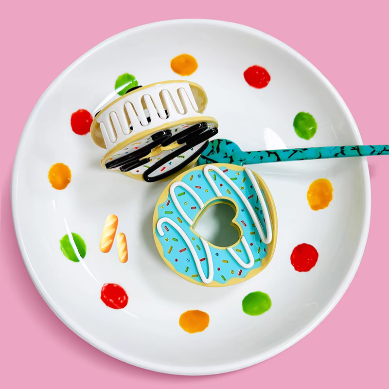 two donut hair clips in blue and white