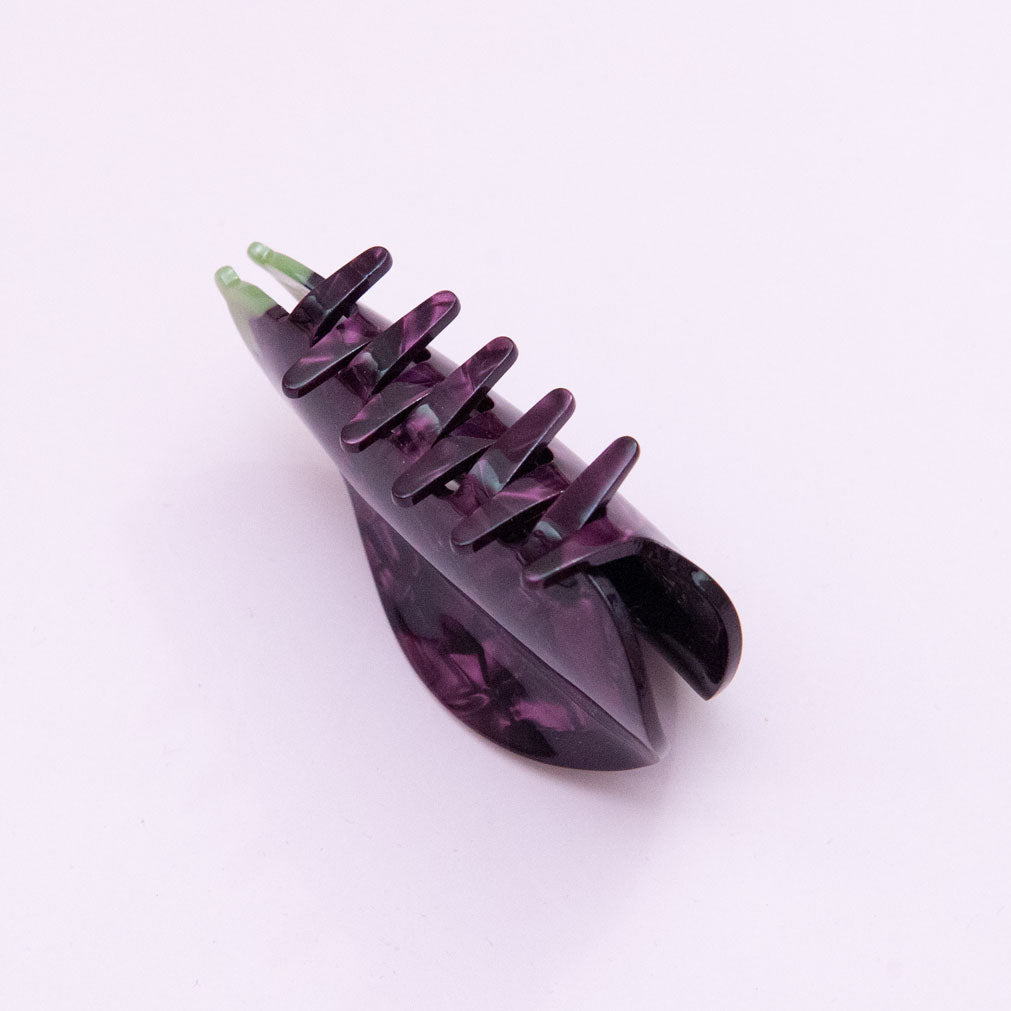 teeth detail of an eggplant hair clip