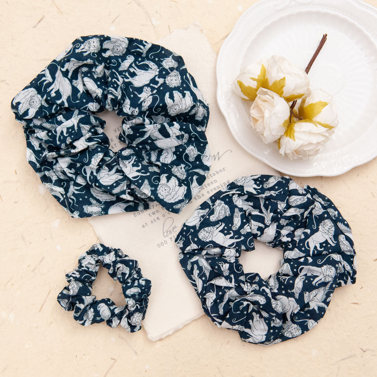 liberty fabric scrunchie in navy in 3 different sizes