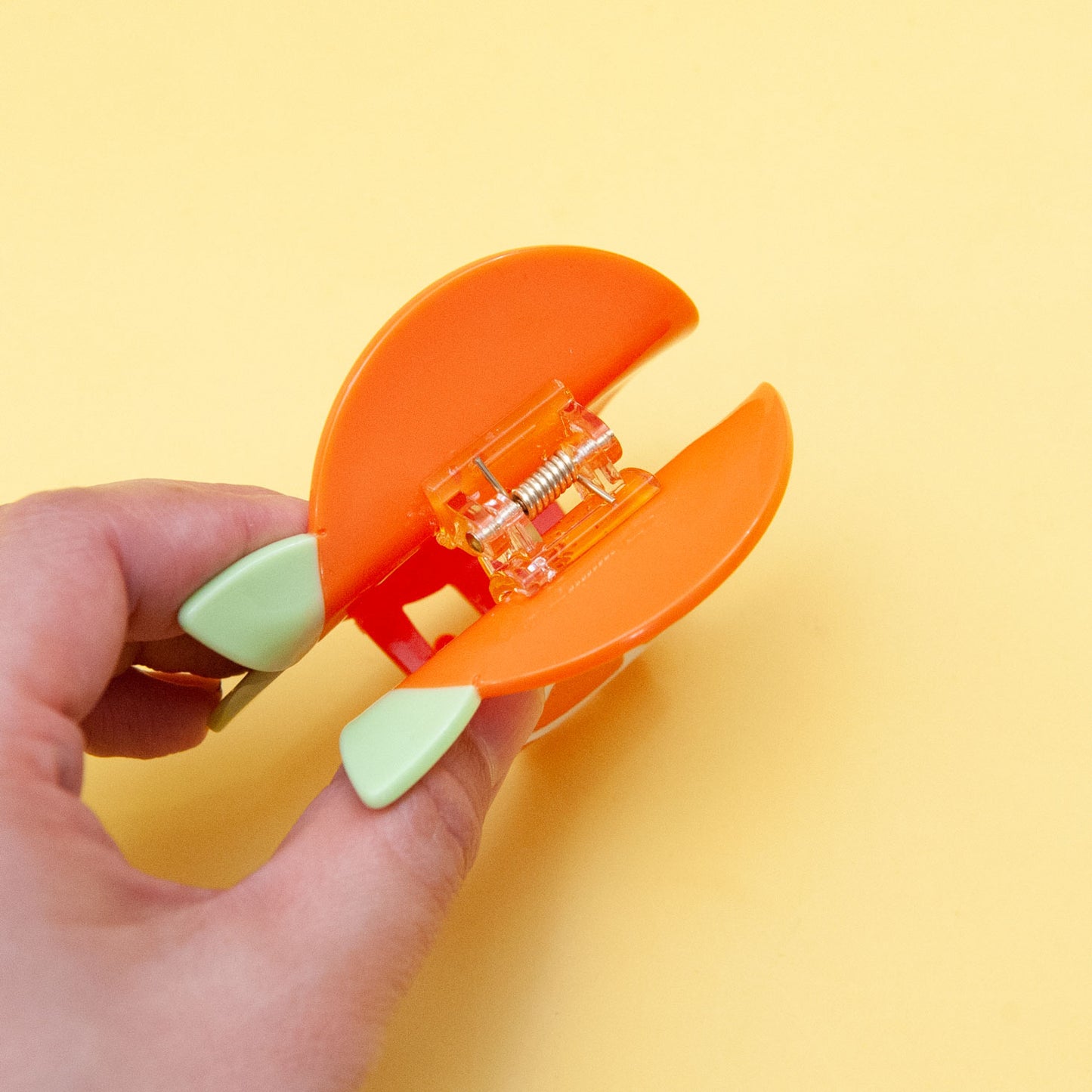 top view of orange hair claw clip
