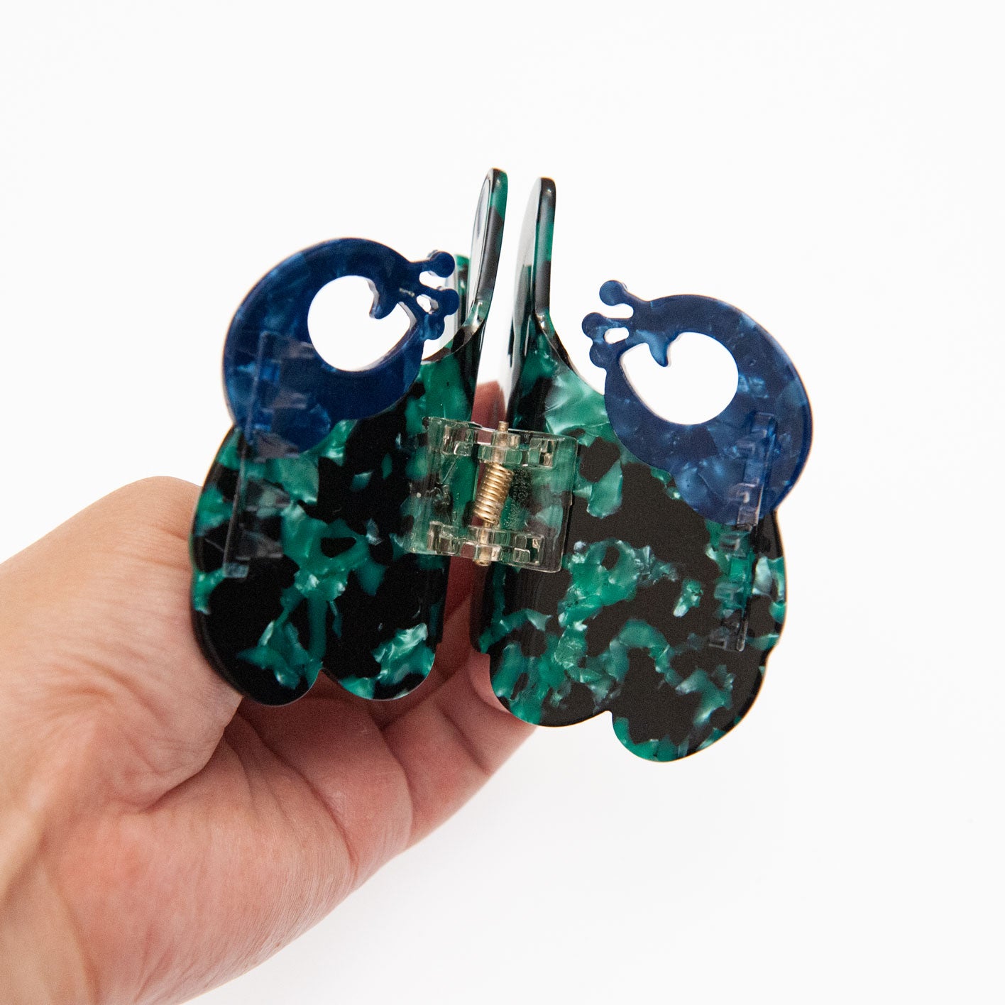 details of peacock hair clip