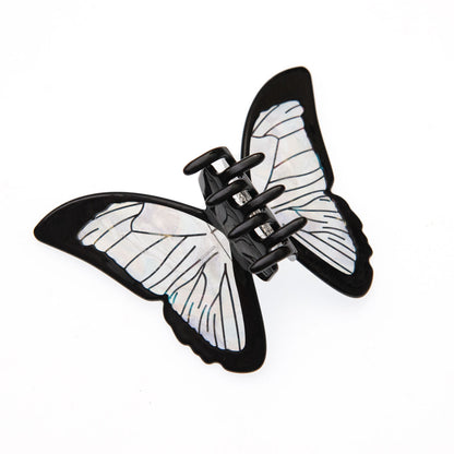 Back view of the black butterfly claw clip with translucent iridescent wings.
