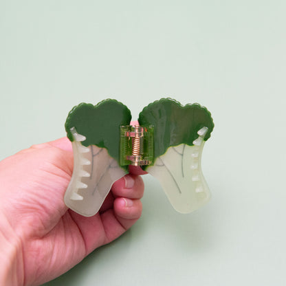 Cute and whimsical broccoli hair claw made from iridescent cellulose acetate with detailed texture.