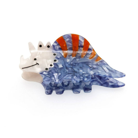 a blue dinosaur hair claw clip on background