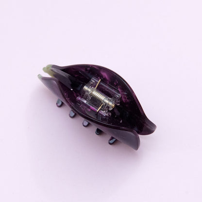 top view of an eggplant hair clip