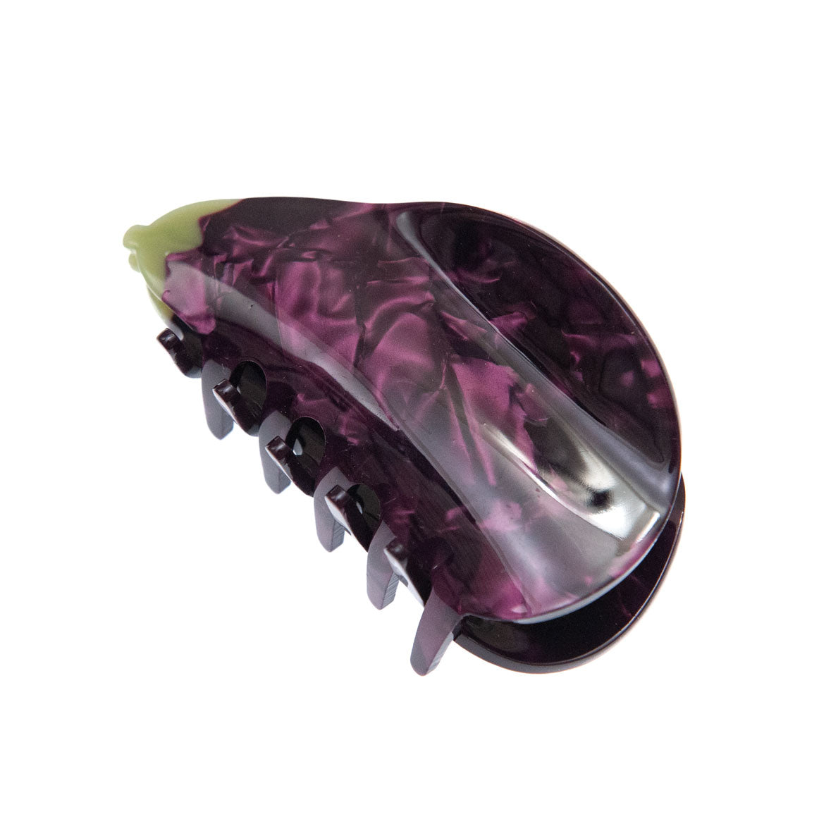 A purple eggplant hair clip on a white background