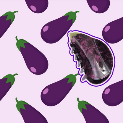 a cute eggplant hair clip on a fun eggplant themed background