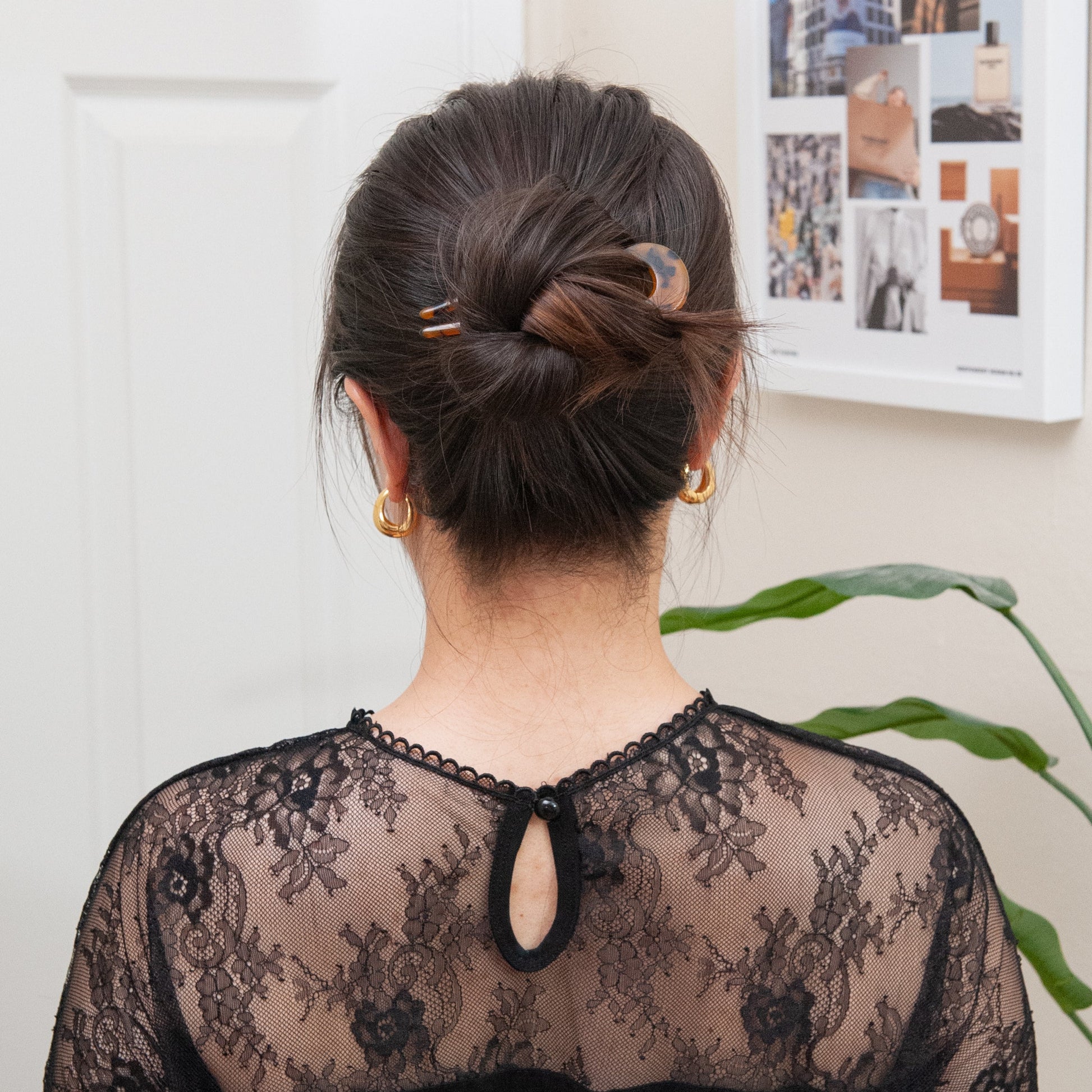 a woman wearing a french style hair pin for a full updo