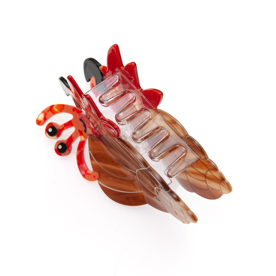 A translucent brown and red hermit crab shaped hair claw clip on a solid white background.