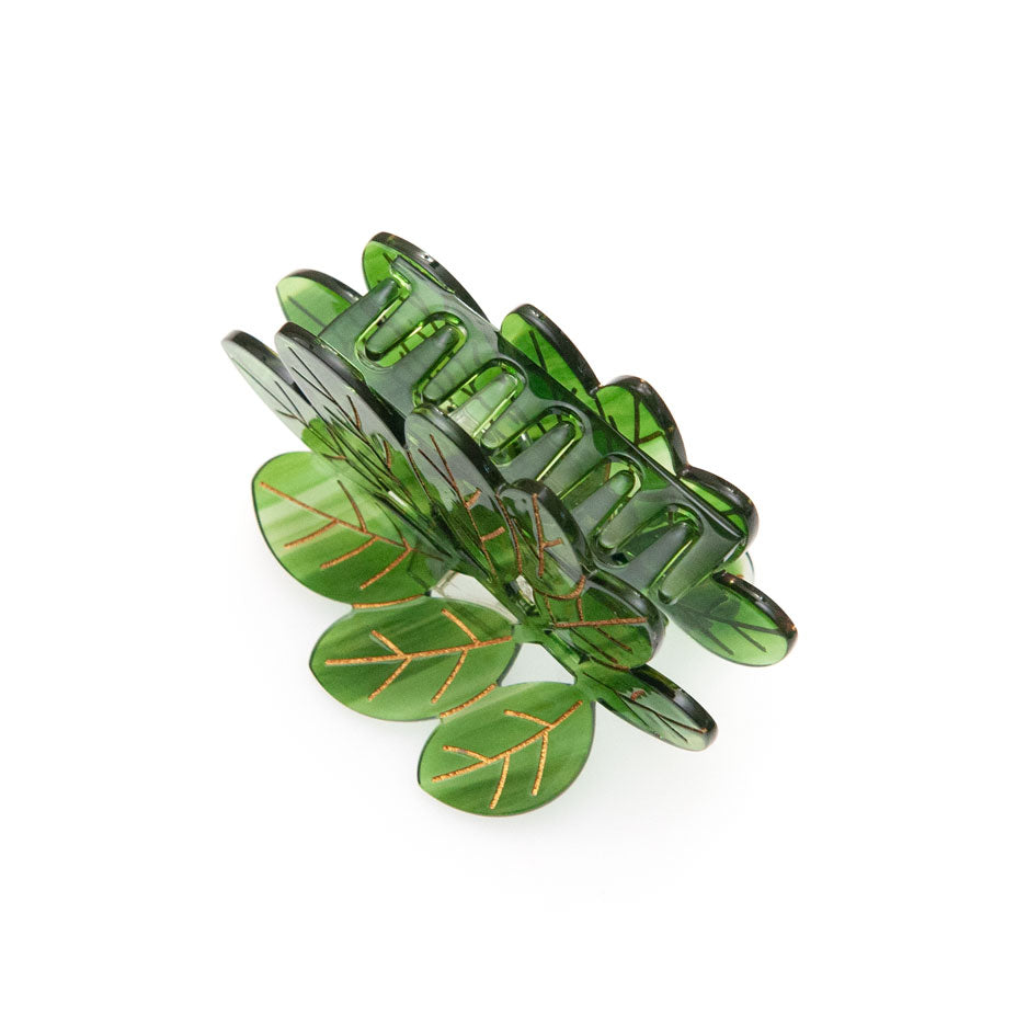 Green leaf-shaped hair clip on a white background