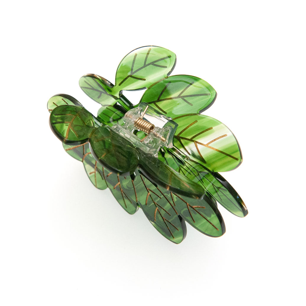 Green leaf-shaped hair clip on a white background