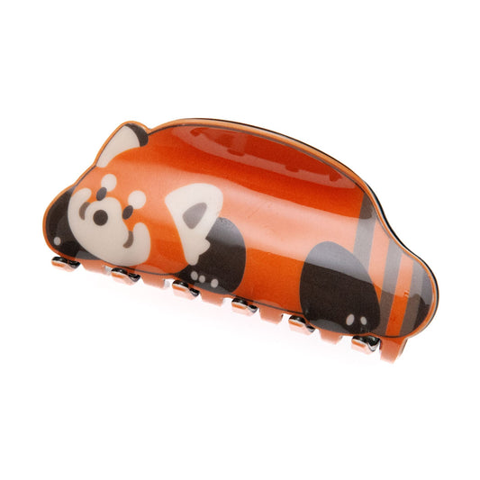 Sleepy red panda hair clip on a white background