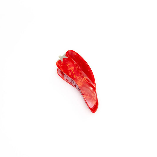 Bright red chili hair claw with green accents, adding a fun and spicy touch to any hairstyle.