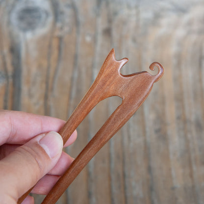 wooden hair stick with a cat design