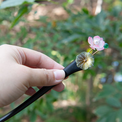 Handmade wooden hair stick with green lotus leaves and a pink lotus flower, symbolizing summer and purity.